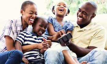 Image Text: 500x332_0011_Happy smiling family on couch